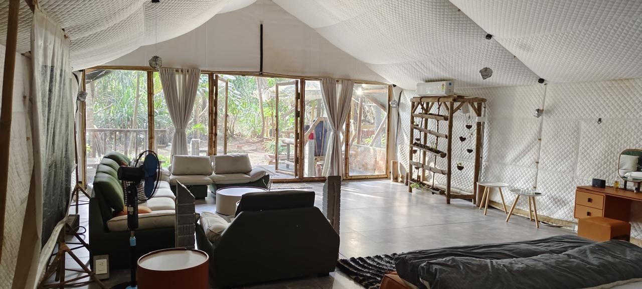 Contemporary Royal Cottage - Unwind in a lavish living space adorned with elegant white sofas, premium furnishings, and exquisite oriental-inspired décor.